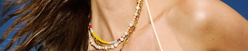 JEWELRY<br><h4>Handcrafted jewelry by artisans worldwide, blending bohemian spirit with modern luxury.<br>Made from sustainable materials, each piece is designed for effortless layering, everyday elegance, and timeless vacation style.</h4>